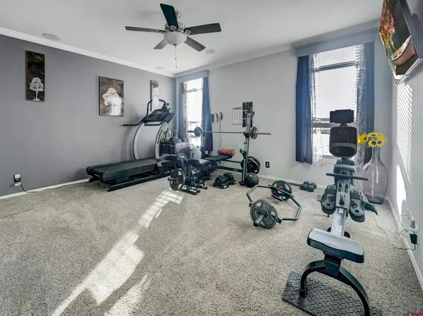 a room with gym equipment and a window
