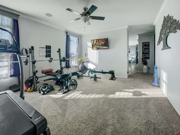 a view of a livingroom with gym equipment