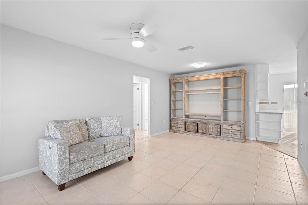 3801 42nd Street West Bradenton, FL 34205 - Photo 7 of 34 a living room with furniture and a dining table with kitchen view