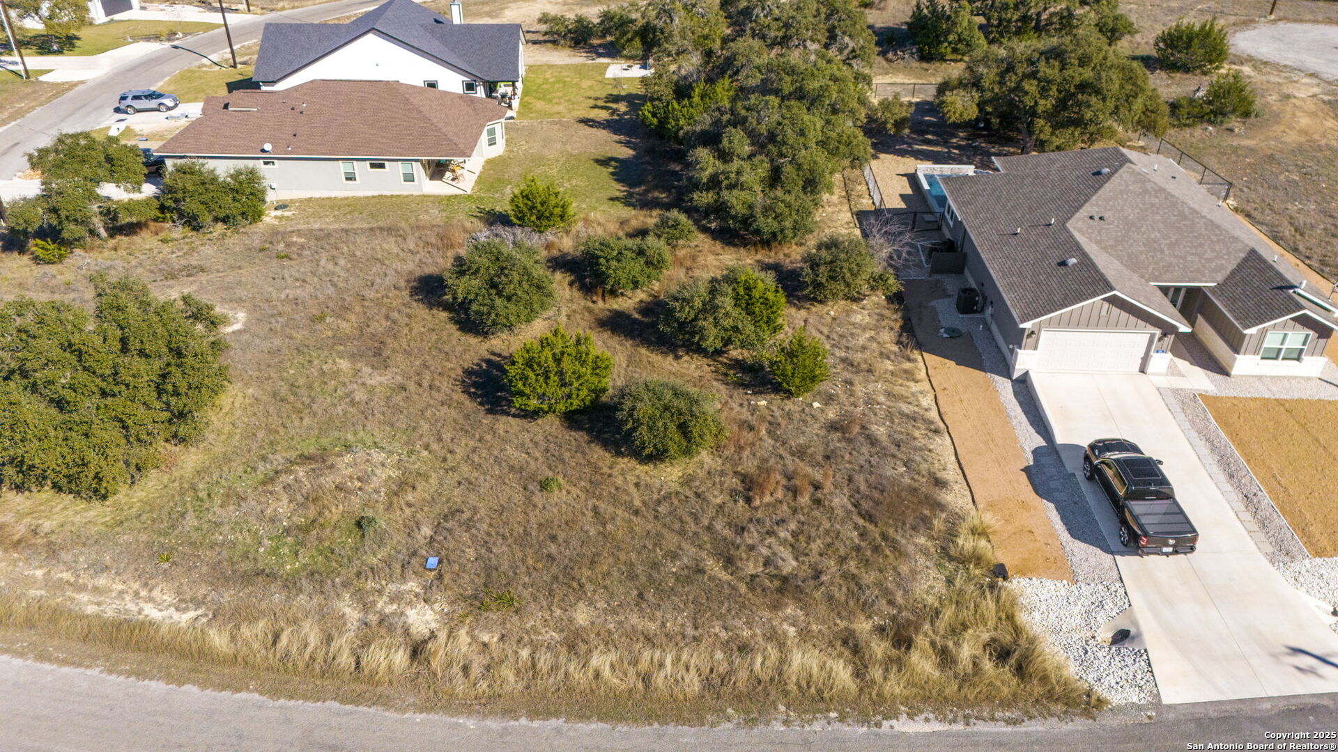 126 North Lon Price Blanco, TX 78606 - Photo 3 of 8 an aerial view of residential houses with outdoor space