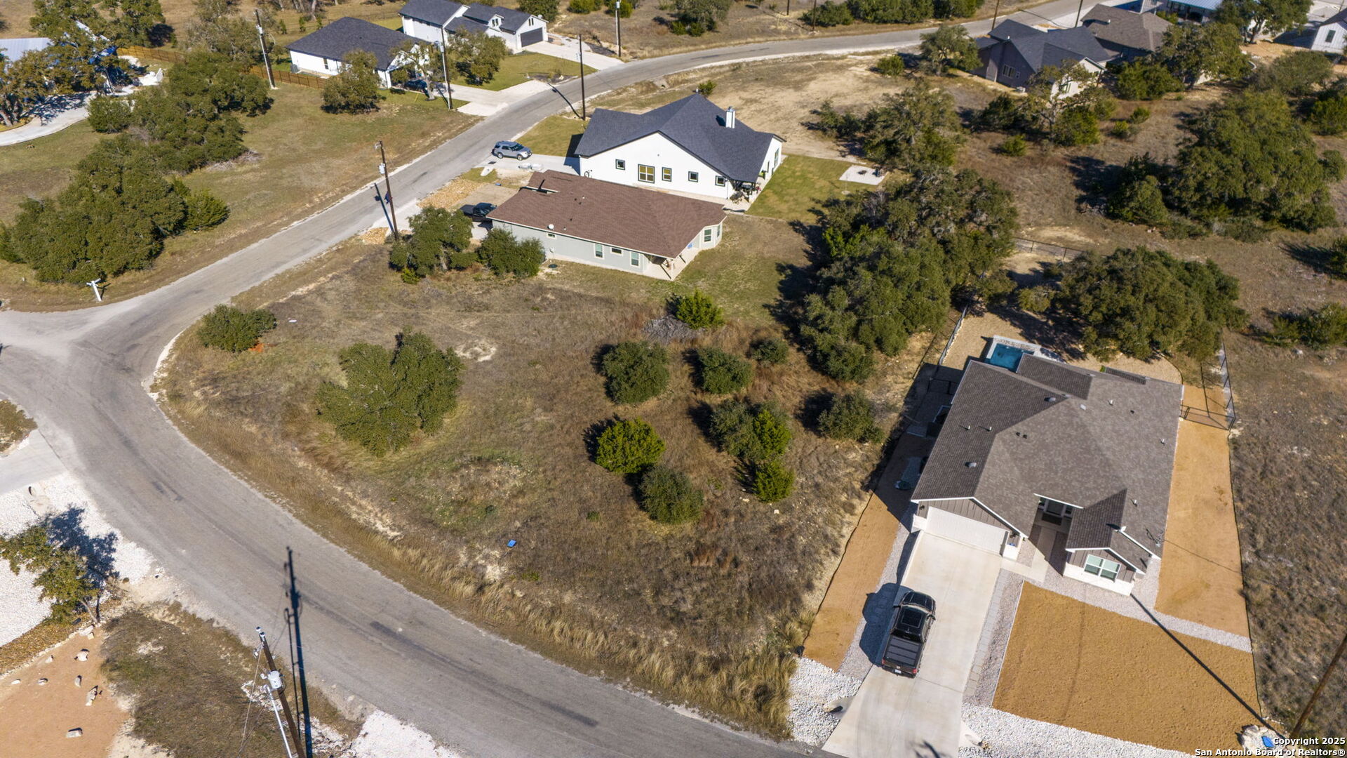 126 North Lon Price Blanco, TX 78606 - Photo 5 of 8 an aerial view of a house with a swimming pool