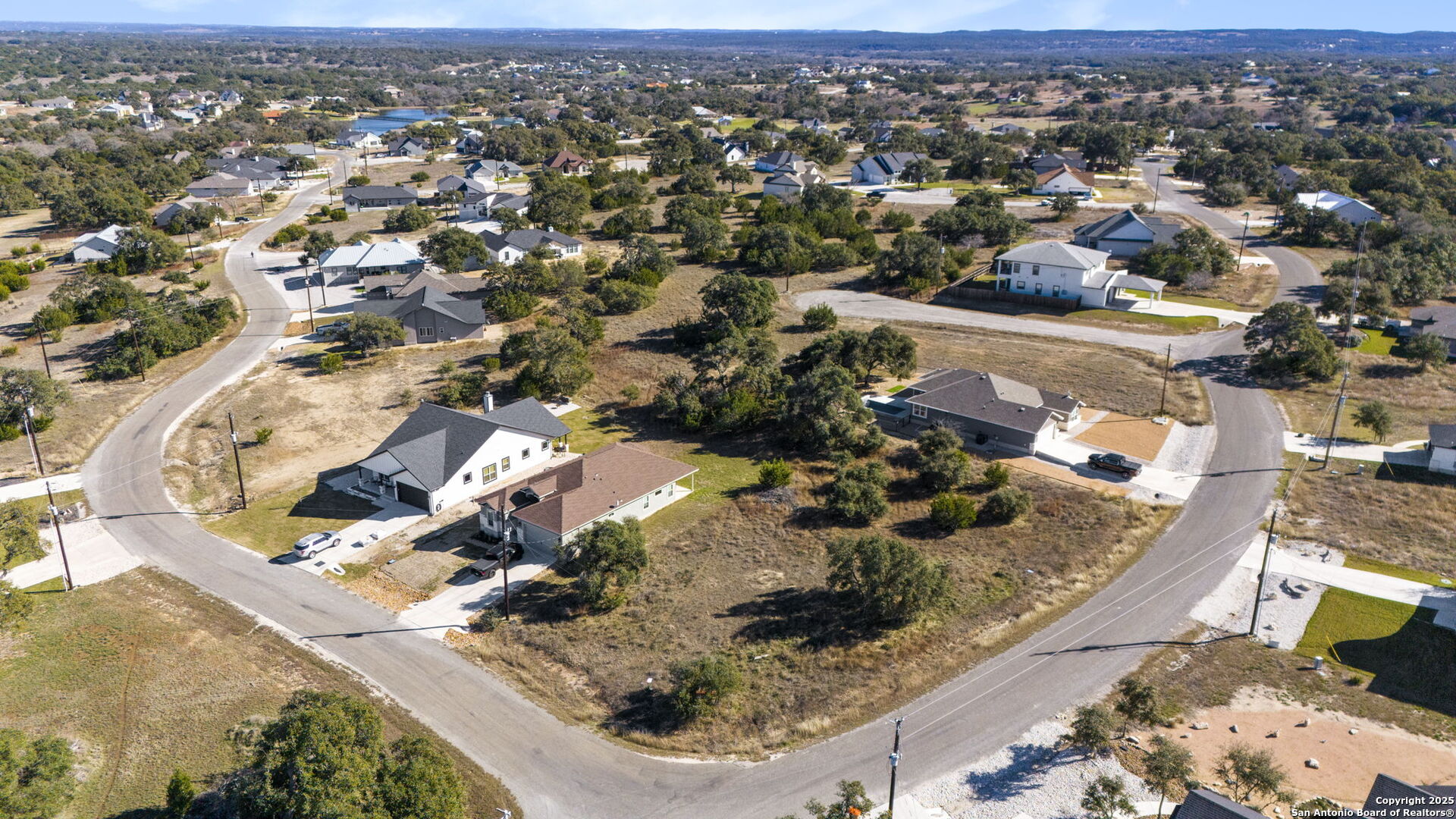 126 North Lon Price Blanco, TX 78606 - Photo 7 of 8 an aerial view of a house with a yard