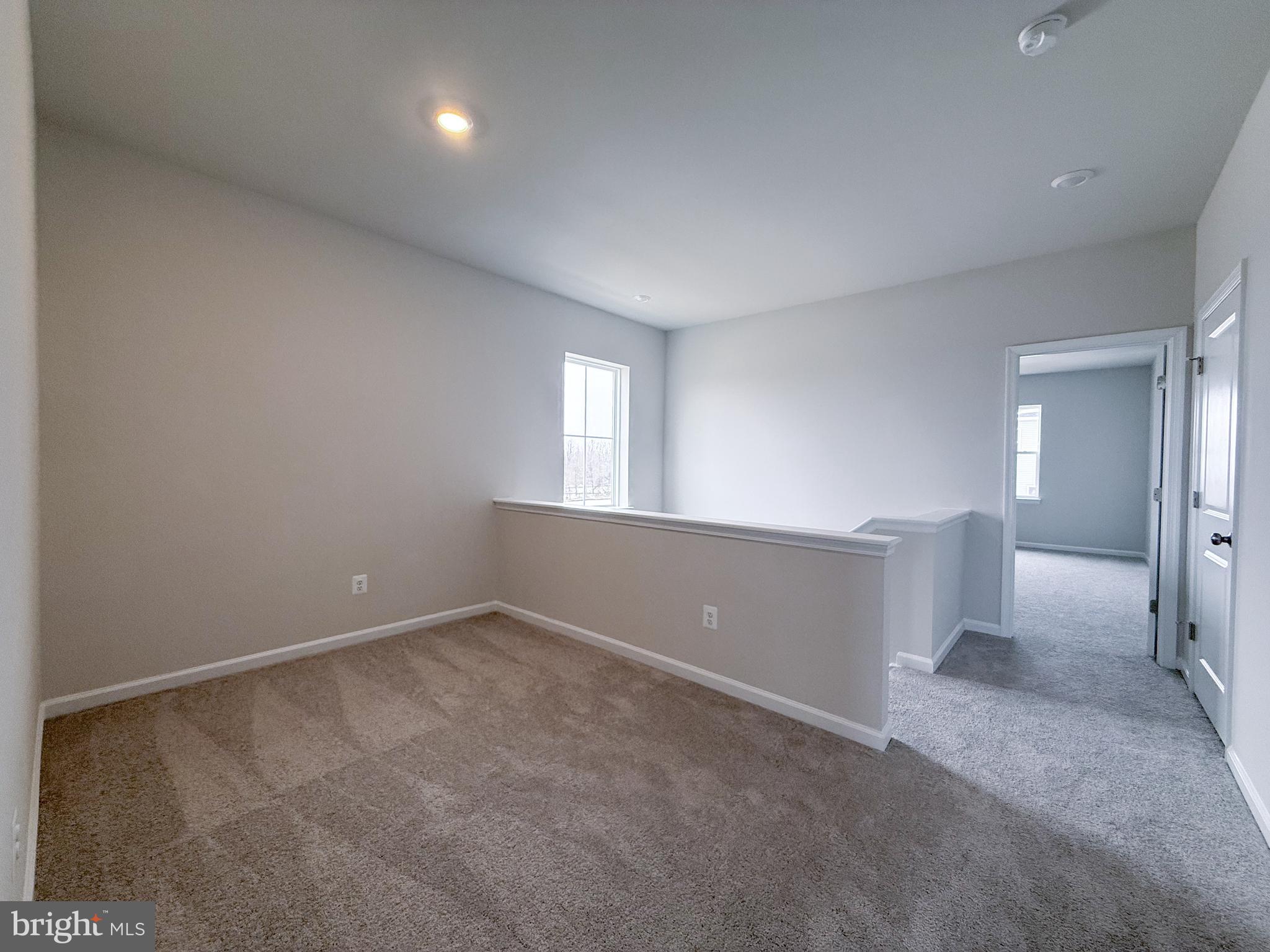 430 Silver Birch Drive Ranson, WV 25438 - Photo 5 of 11 an empty room with windows and entrance