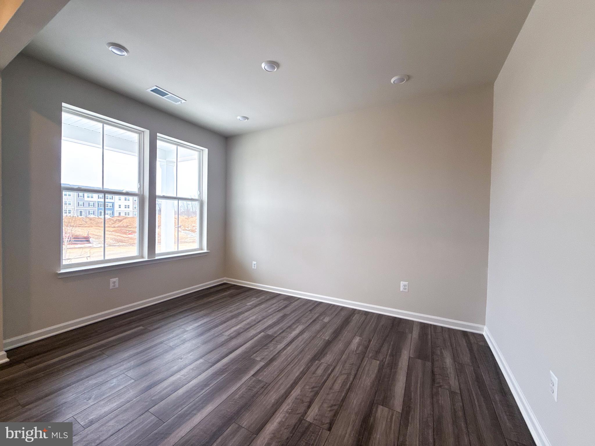 430 Silver Birch Drive Ranson, WV 25438 - Photo 9 of 11 wooden floor in an empty room with a window