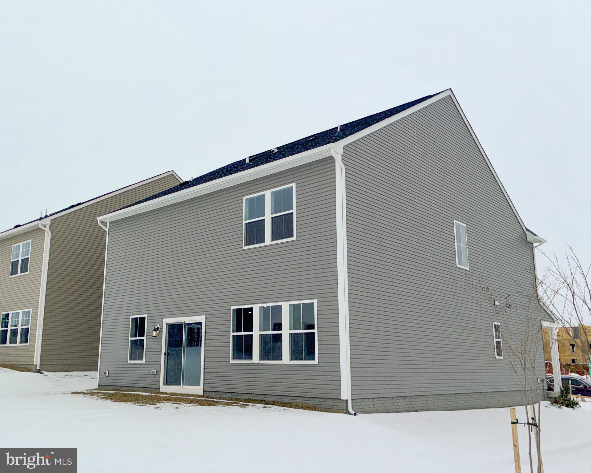 430 Silver Birch Drive Ranson, WV 25438 - Photo 10 of 11 a front view of a house with garage
