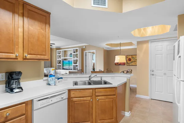 a kitchen with sink and cabinets