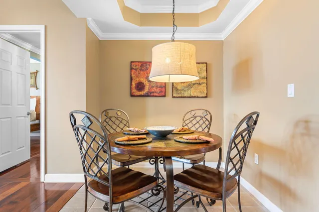 a view of a dining room with furniture and wooden floor