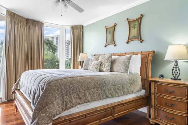 a bedroom with a bed and lamp with window