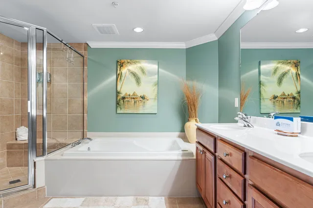 a bathroom with a tub a sink and mirror