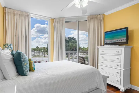 a bedroom with a bed and a flat screen tv