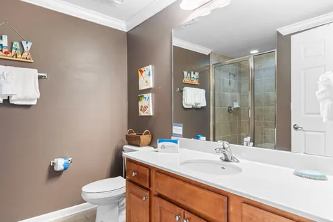 a bathroom with a sink toilet and shower