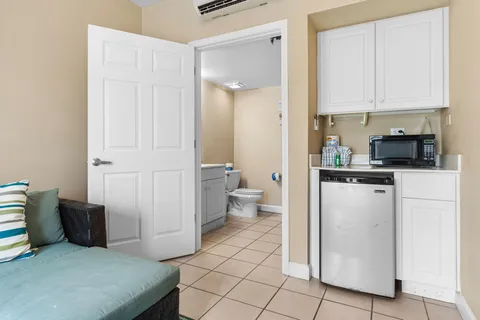 a bathroom with a sink mirror vanity and toilet