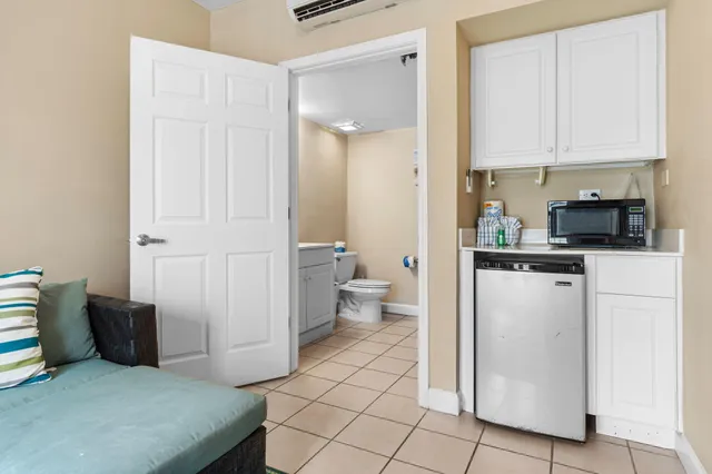a bathroom with a sink mirror vanity and toilet