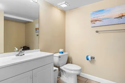 a view of a balcony with wooden chairs