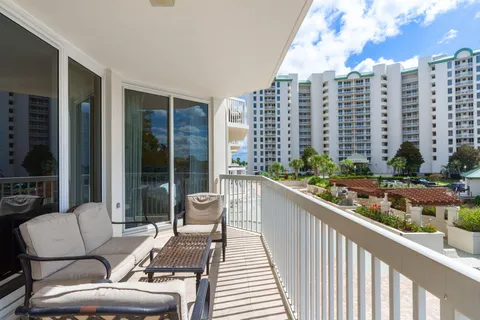 a front view of a multi story building with yard