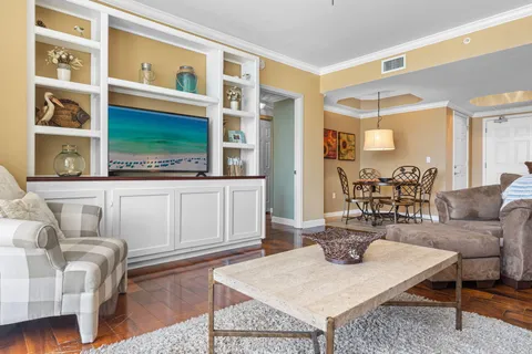 a living room with furniture a rug and a window