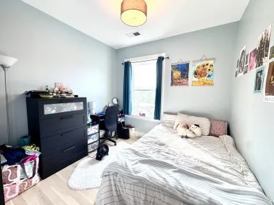 a bedroom with a bed and furniture