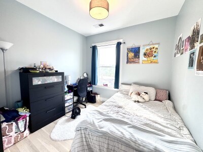 9 University Road, Unit 3 Brookline, MA 02445 - Photo 11 of 13 a bedroom with a bed and furniture