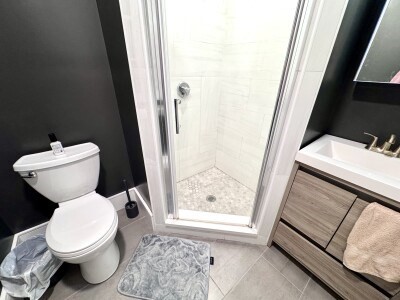 9 University Road, Unit 3 Brookline, MA 02445 - Photo 12 of 13 a white toilet sitting next to a bathroom sink