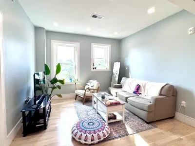 a living room with furniture and a window