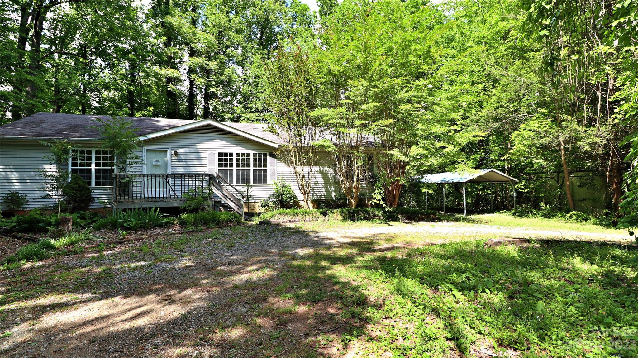 61 Sloan Street Old Fort, NC 28762 - Photo 1 of 38 a front view of a house with a yard