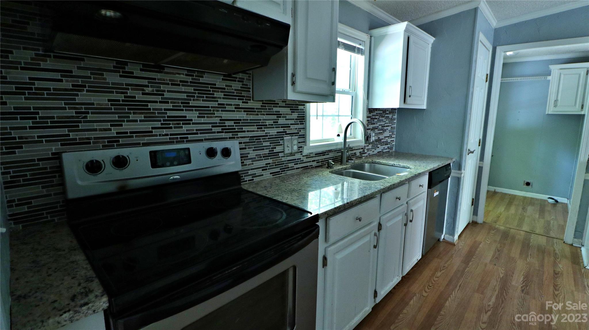 61 Sloan Street Old Fort, NC 28762 - Photo 11 of 38 a kitchen with a stove and a sink
