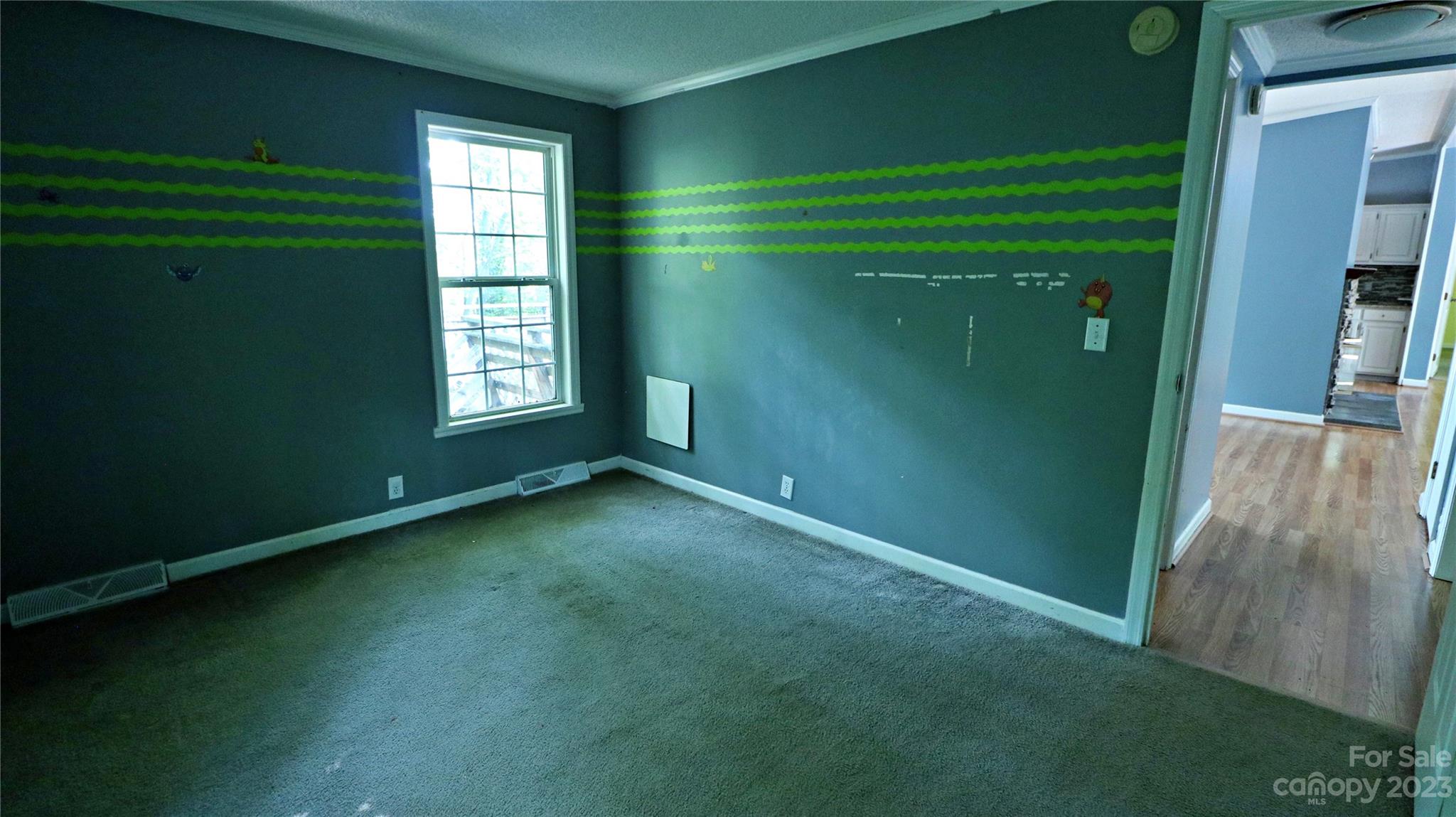61 Sloan Street Old Fort, NC 28762 - Photo 17 of 38 a view of an empty room with closet and a window