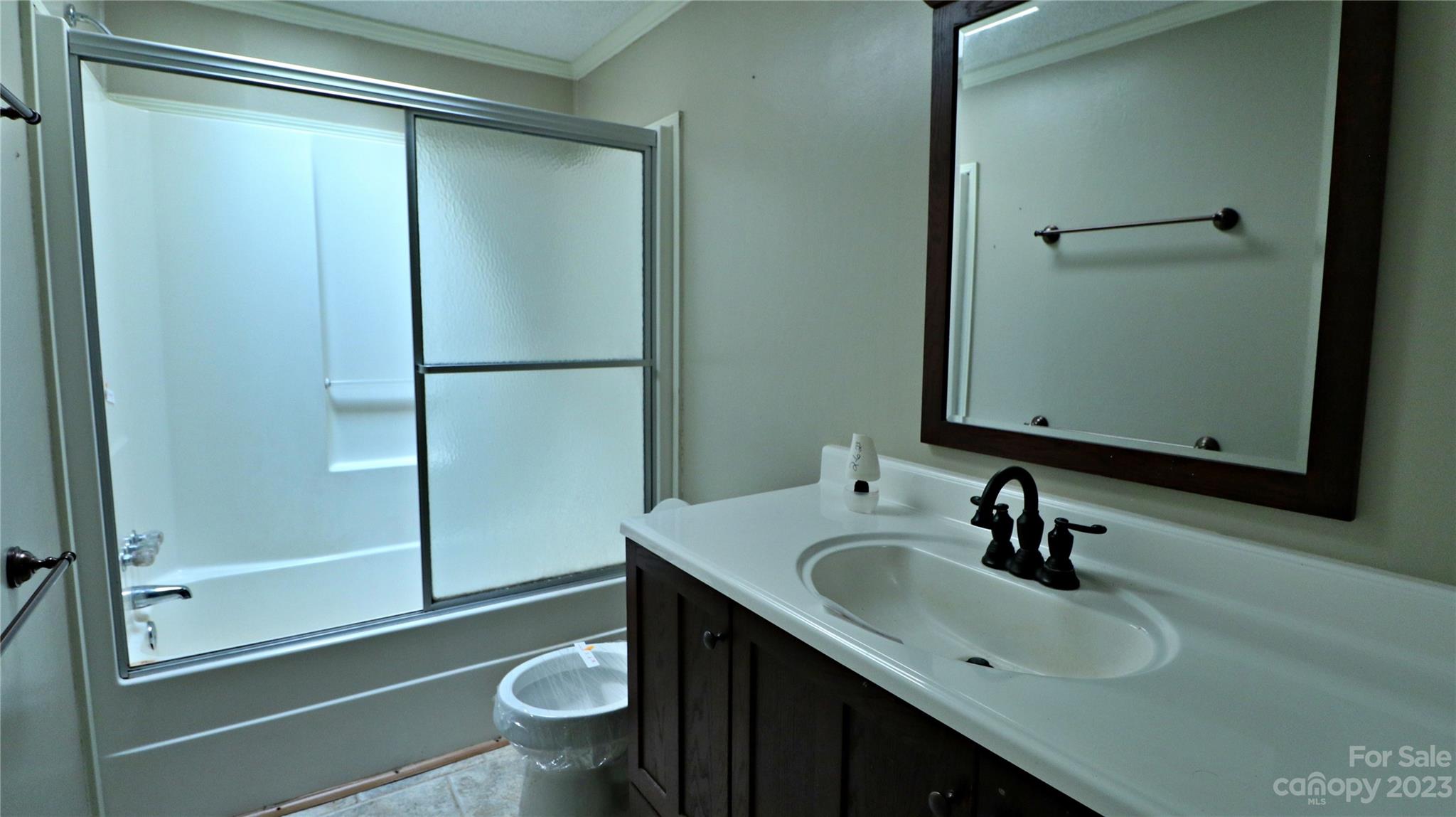 61 Sloan Street Old Fort, NC 28762 - Photo 19 of 38 a bathroom with a sink toilet and shower