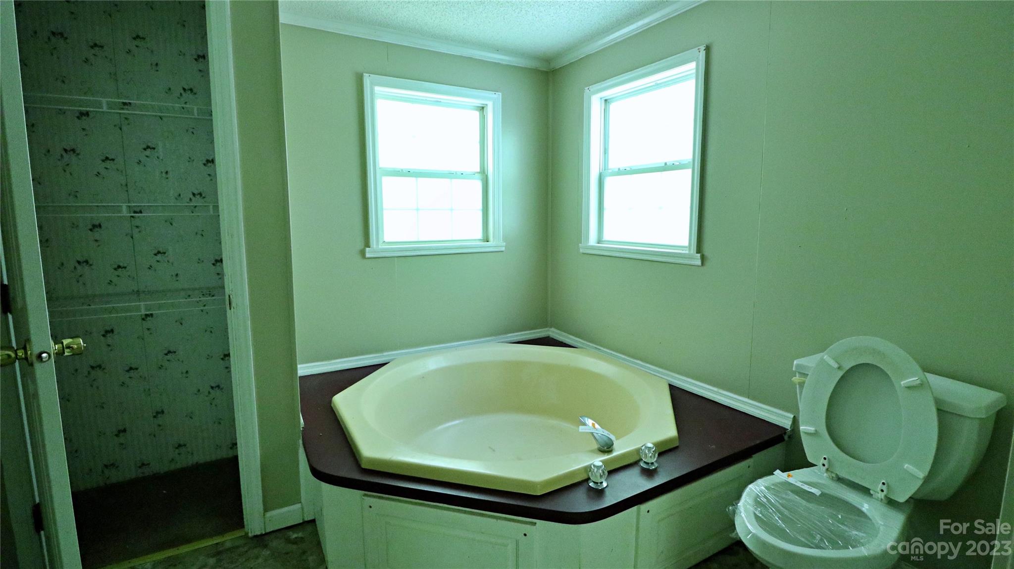 61 Sloan Street Old Fort, NC 28762 - Photo 25 of 38 a bathroom with a toilet and a sink