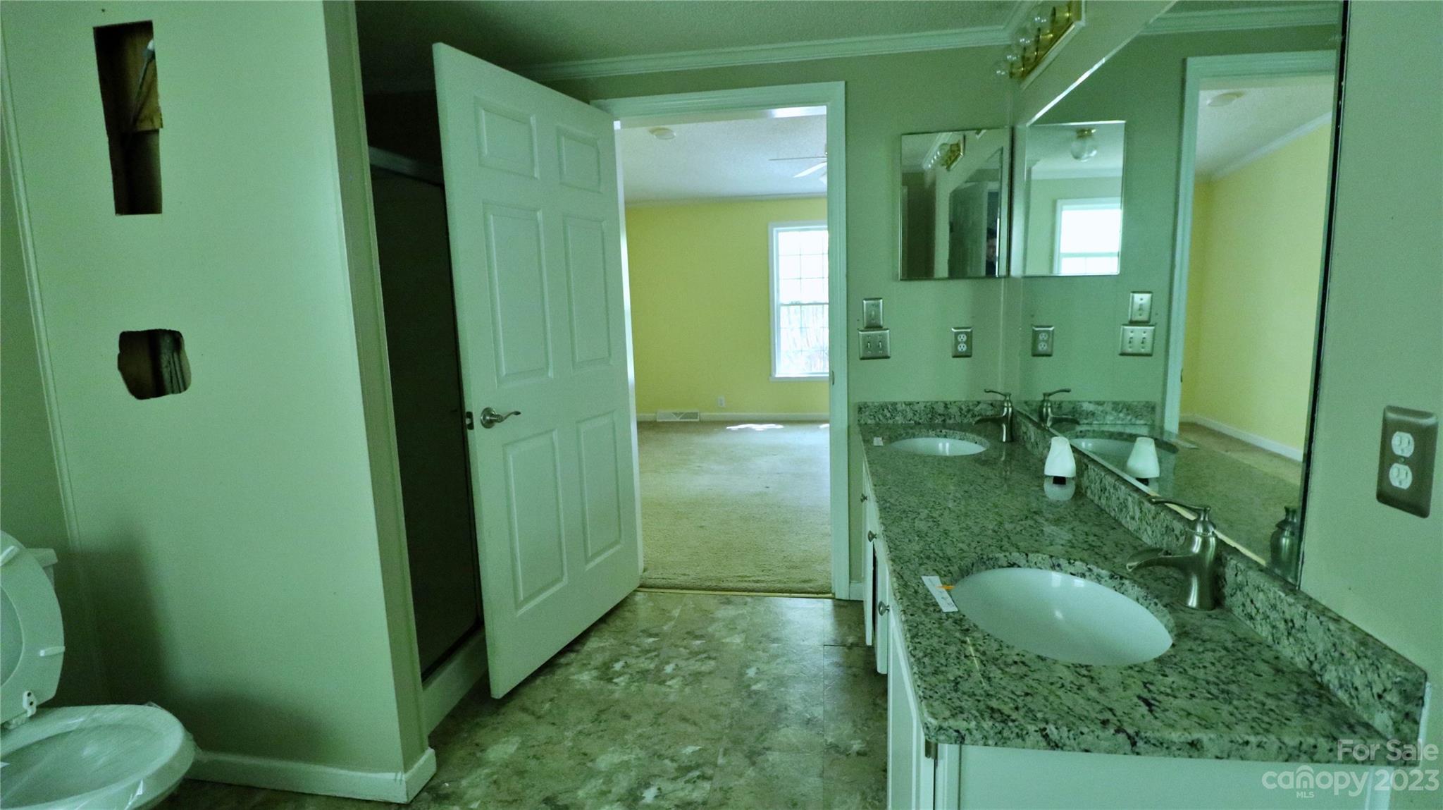 61 Sloan Street Old Fort, NC 28762 - Photo 26 of 38 a bathroom with a sink a toilet and shower