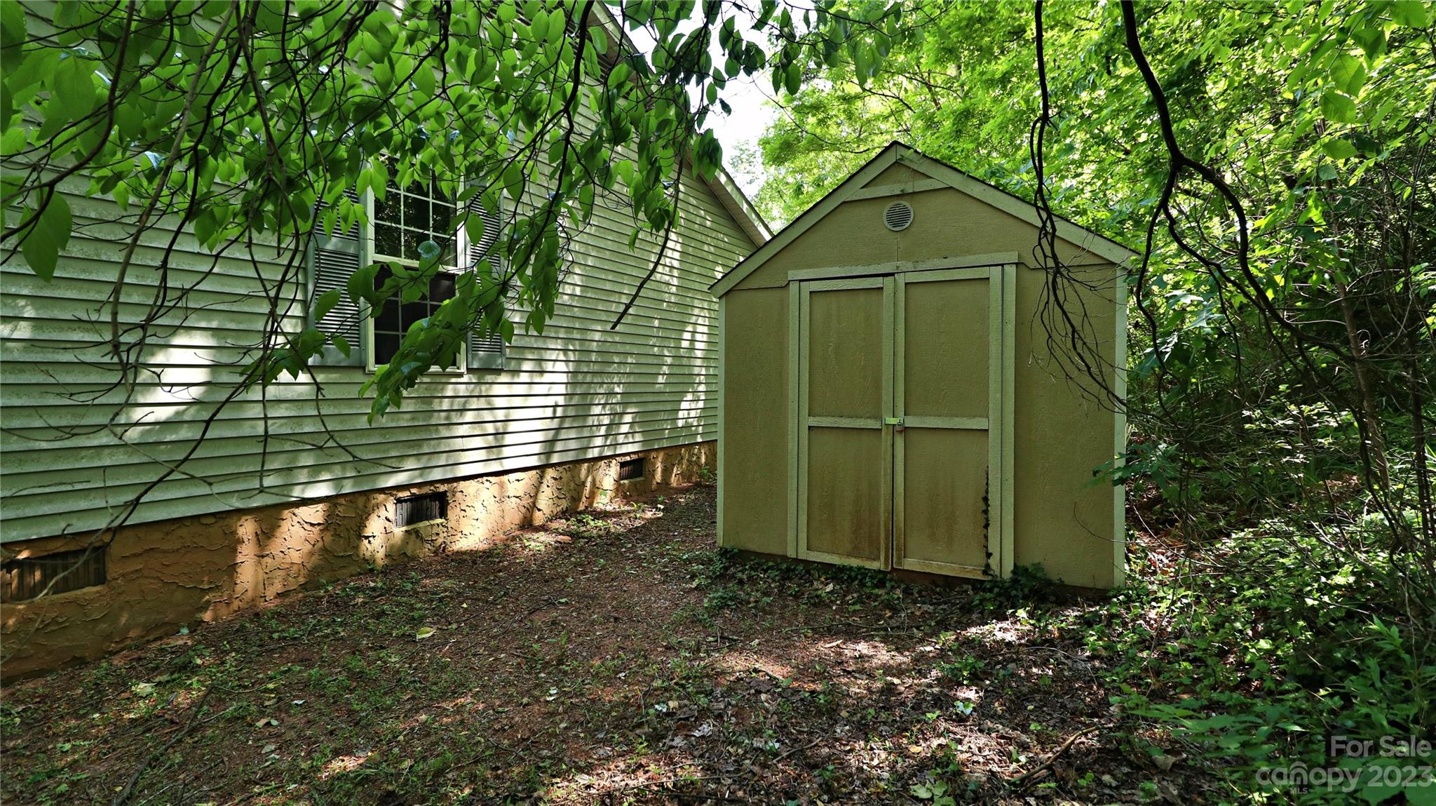 61 Sloan Street Old Fort, NC 28762 - Photo 32 of 38 a view of a house with a small yard
