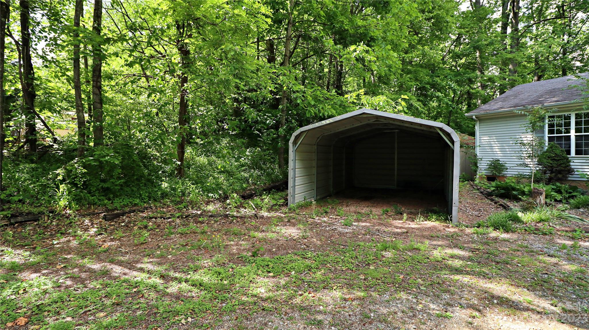 61 Sloan Street Old Fort, NC 28762 - Photo 34 of 38 a backyard of a house with lots of green space