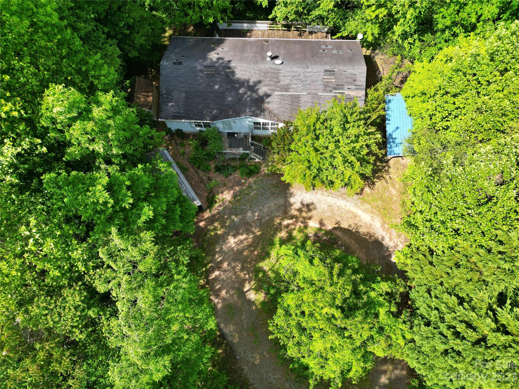 61 Sloan Street Old Fort, NC 28762 - Photo 6 of 38 an aerial view of a house with a yard and garden