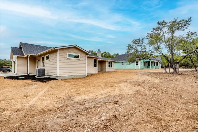a house with trees in the background