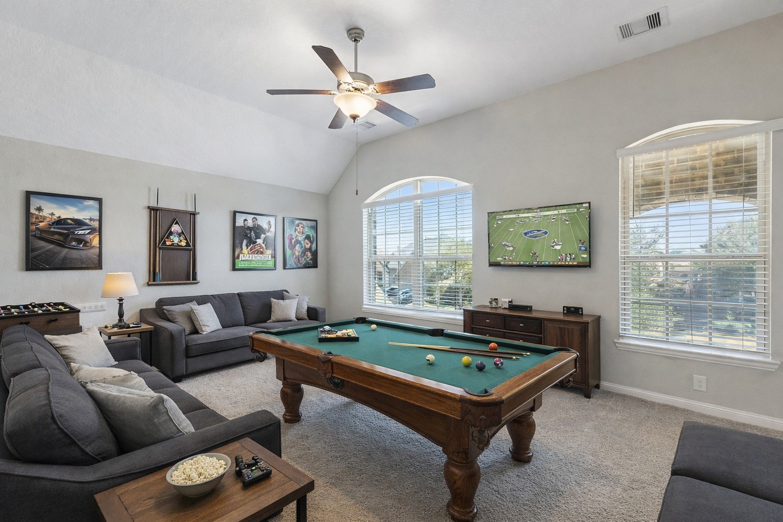 1619 Dove Ridge Drive Katy, TX 77493 - Photo 14 of 28 The expansive upstairs gameroom features high ceilings and large windows, providing a versatile space for play or relaxation. Virtually staged so you can imagine possibilities.
