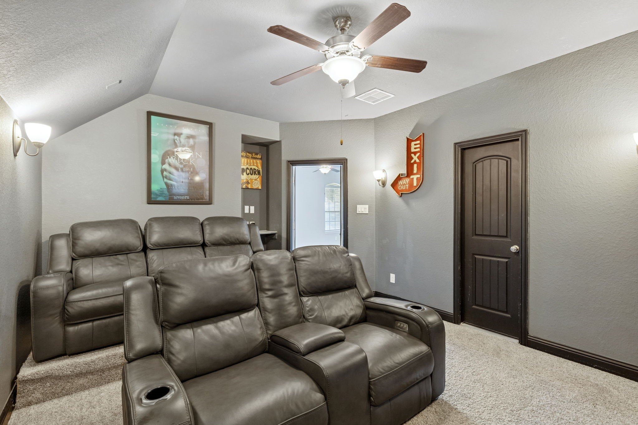 1619 Dove Ridge Drive Katy, TX 77493 - Photo 16 of 28 A true media retreat designed for comfort, featuring plush reclining seating, elevated sightlines, and a vaulted ceiling for an immersive movie-night experience. This dedicated space is perfect for game days, streaming marathons, or entertaining guests in style.