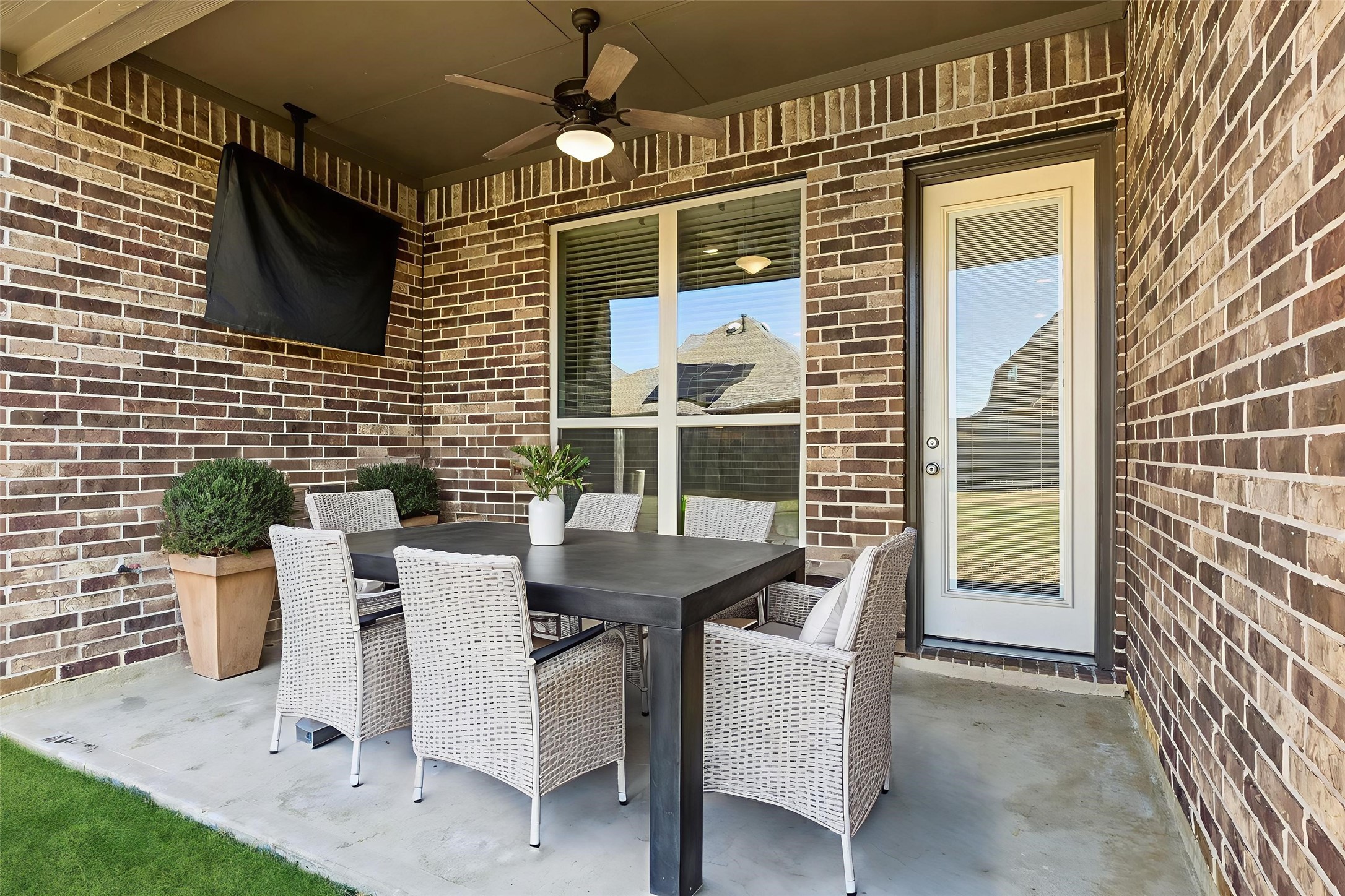 1619 Dove Ridge Drive Katy, TX 77493 - Photo 20 of 28 The covered patio offers plenty of space for a lounge setup or outdoor dining, creating a versatile area to enjoy the backyard. Virtually staged.