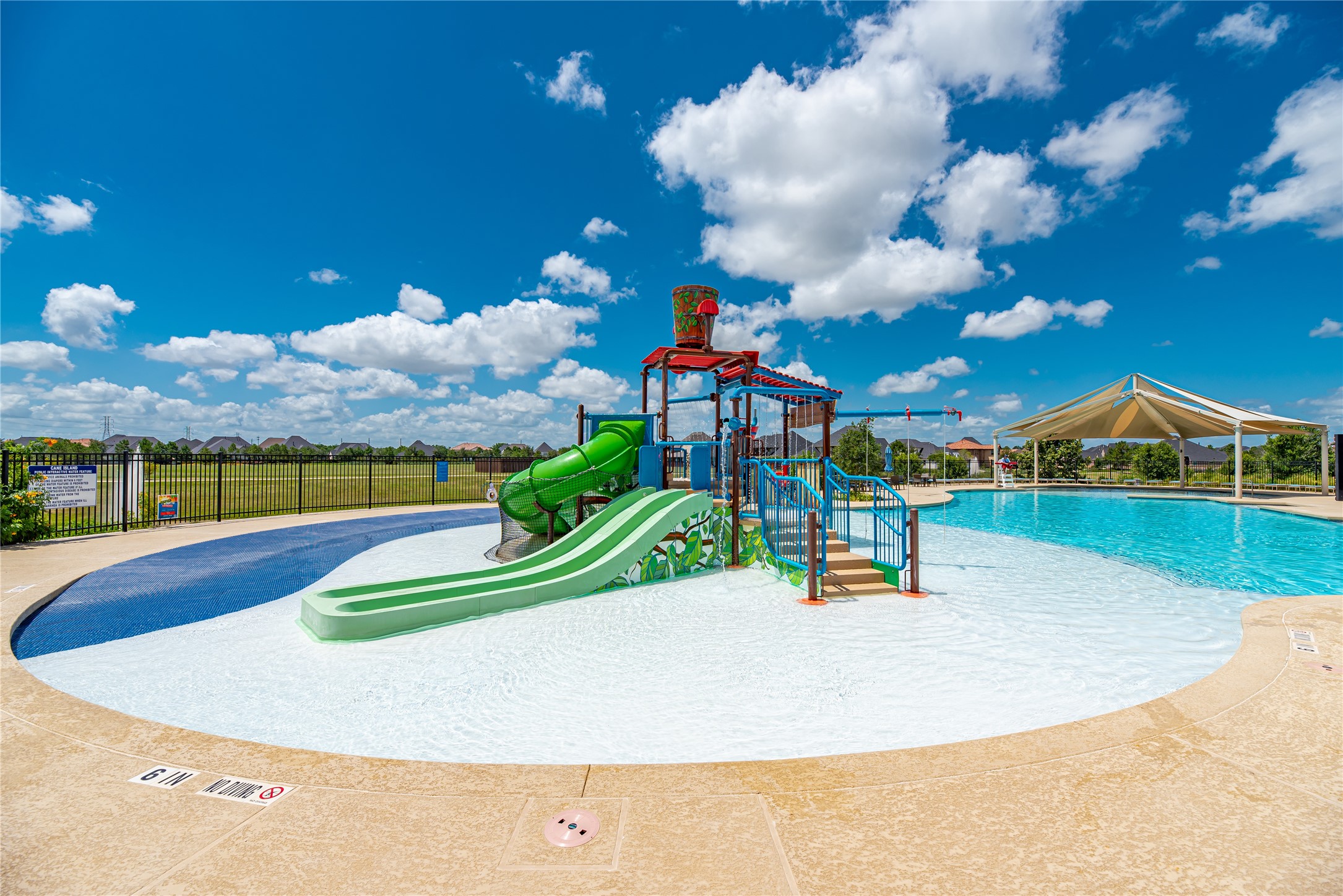 1619 Dove Ridge Drive Katy, TX 77493 - Photo 24 of 28 Lounge in the poolside cabanas or watch the kids play under the 500-gallon splash bucket at our family-friendly pool.