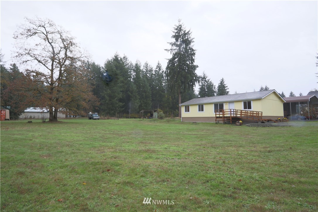 10046 168th Avenue Southwest Rochester, WA 98579 - Photo 28 of 33 a front view of a house with a garden