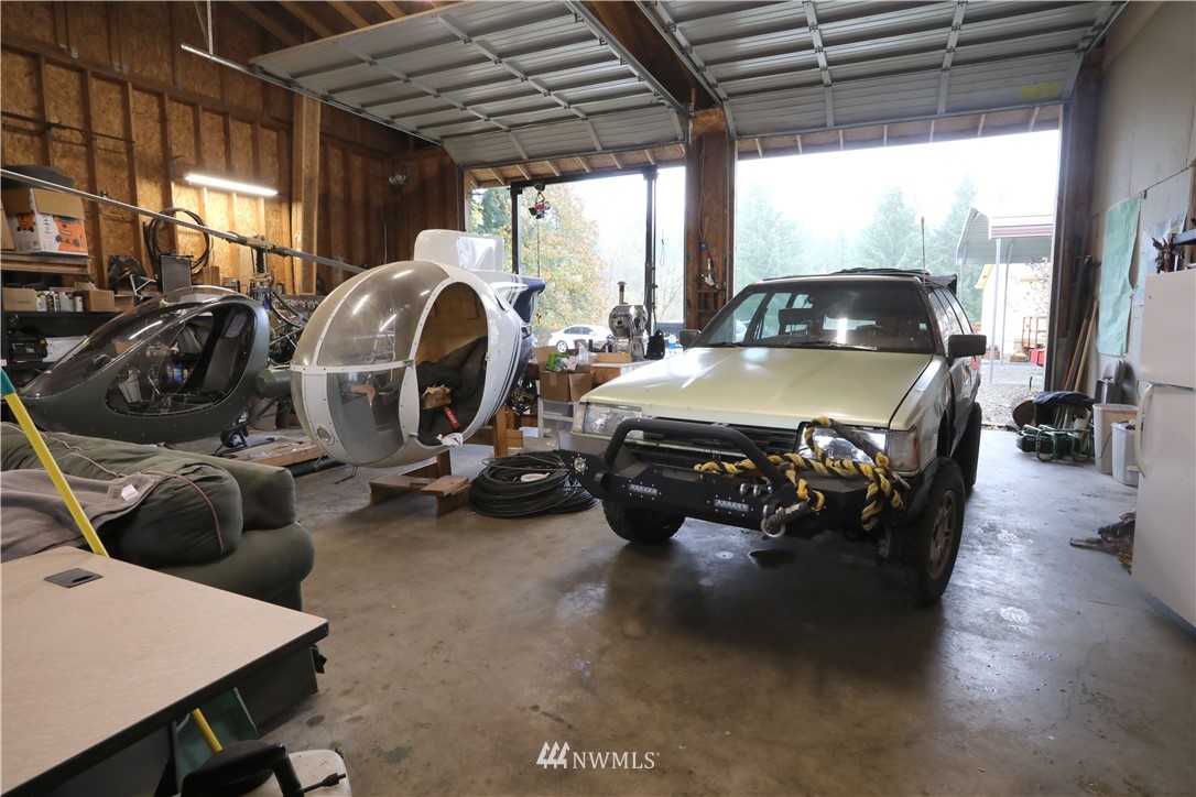 10046 168th Avenue Southwest Rochester, WA 98579 - Photo 31 of 33 a view of car parked in garage