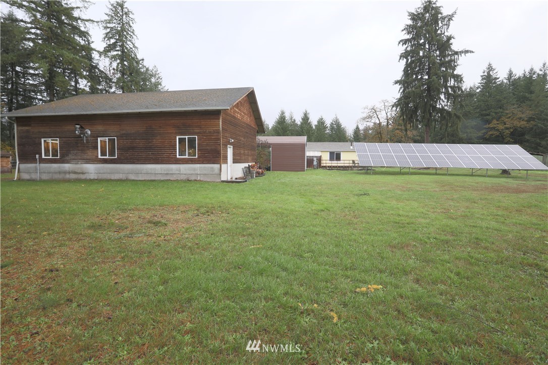 10046 168th Avenue Southwest Rochester, WA 98579 - Photo 5 of 33 a backyard of a house with lots of green space