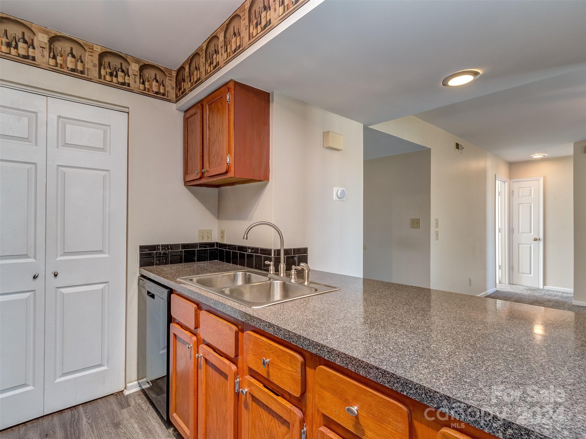11014 Cedar View Road Charlotte, NC 28226 - Photo 11 of 32 a kitchen with stainless steel appliances granite countertop a sink and a refrigerator