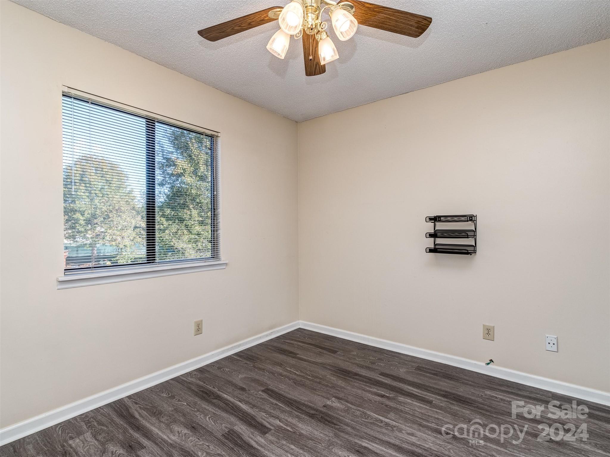 11014 Cedar View Road Charlotte, NC 28226 - Photo 25 of 32 an empty room with wooden floor and windows