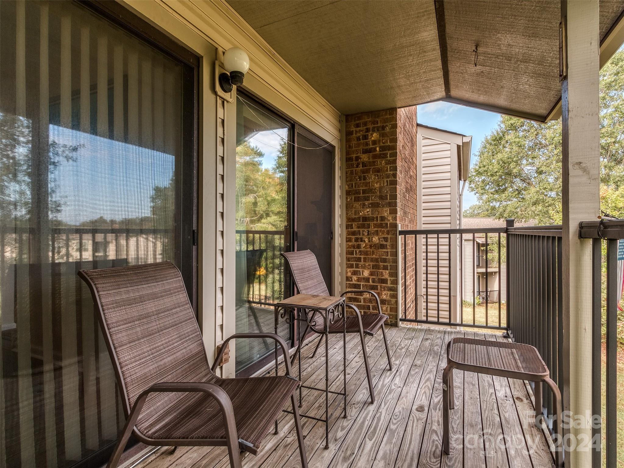 11014 Cedar View Road Charlotte, NC 28226 - Photo 3 of 32 a view of a balcony with chairs