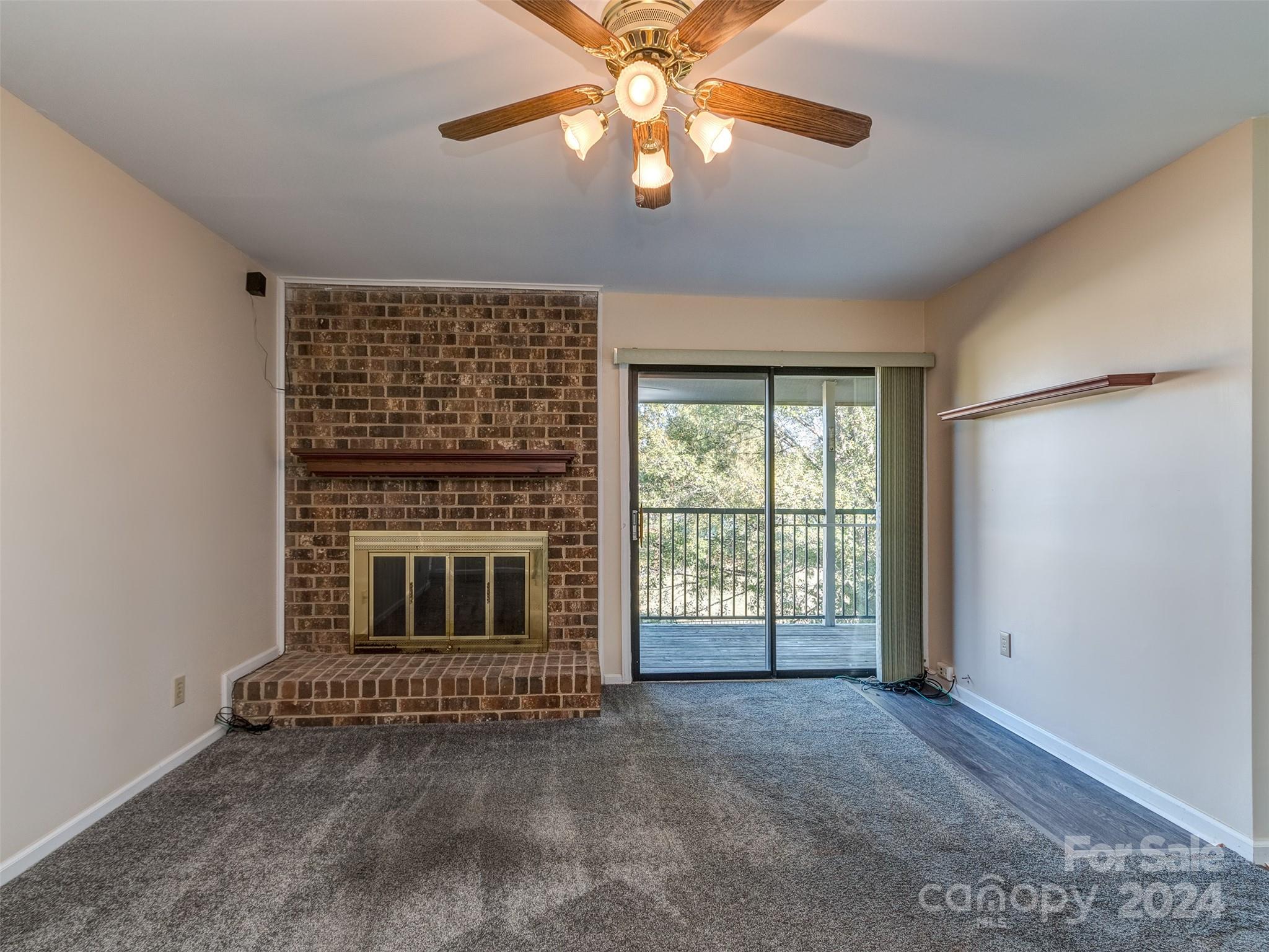 11014 Cedar View Road Charlotte, NC 28226 - Photo 6 of 32 a living room with furniture and a fireplace