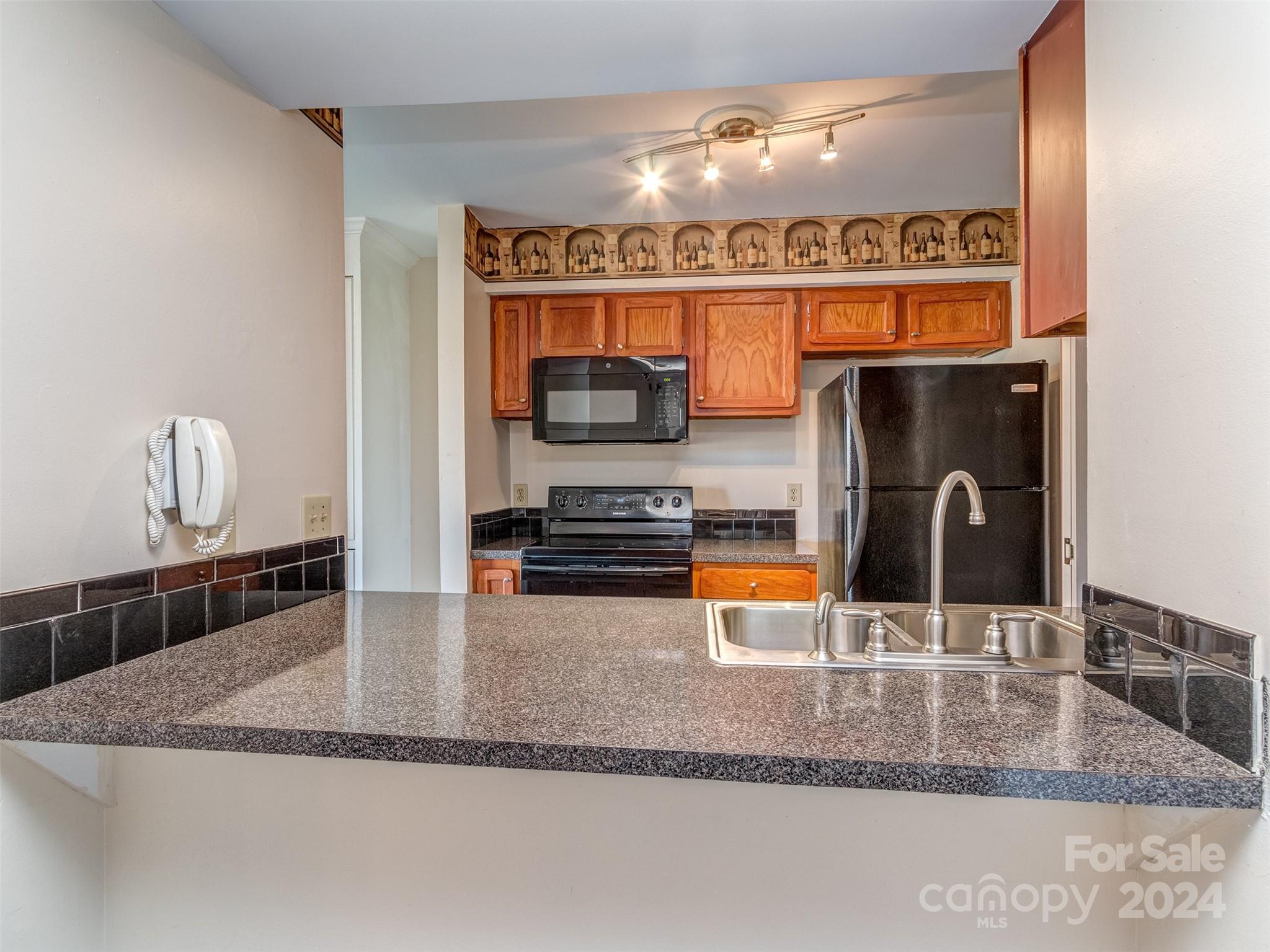 11014 Cedar View Road Charlotte, NC 28226 - Photo 9 of 32 a kitchen with a sink a counter and appliances