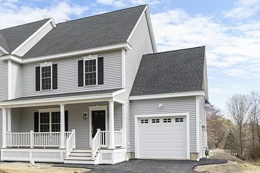 a front view of a house with a garage