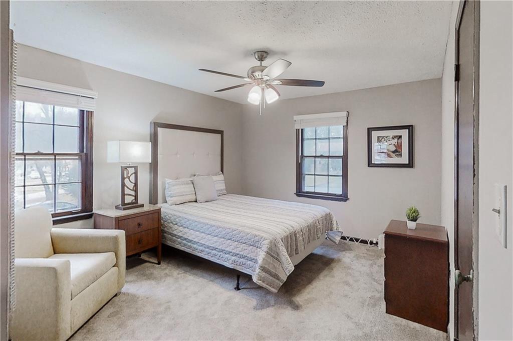 2284 Emerald Springs Drive Decatur, GA 30035 - Photo 15 of 30 a spacious bedroom with a bed and a couch