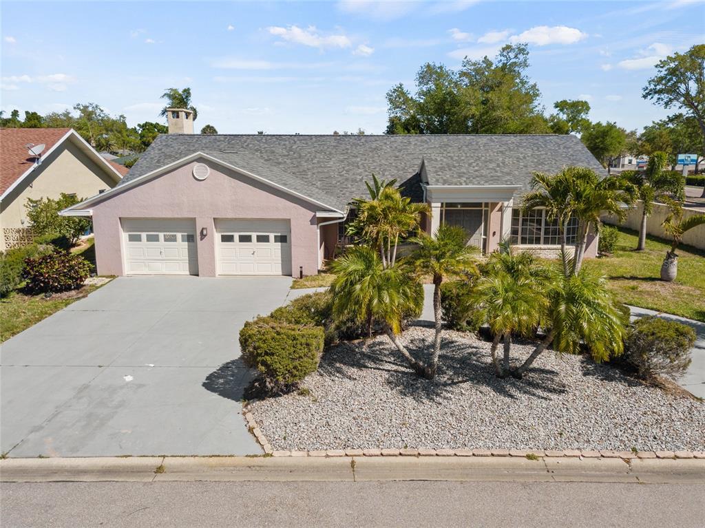 1009 Kings Court Venice, FL 34293 - Photo 1 of 25 front view of a house with a yard