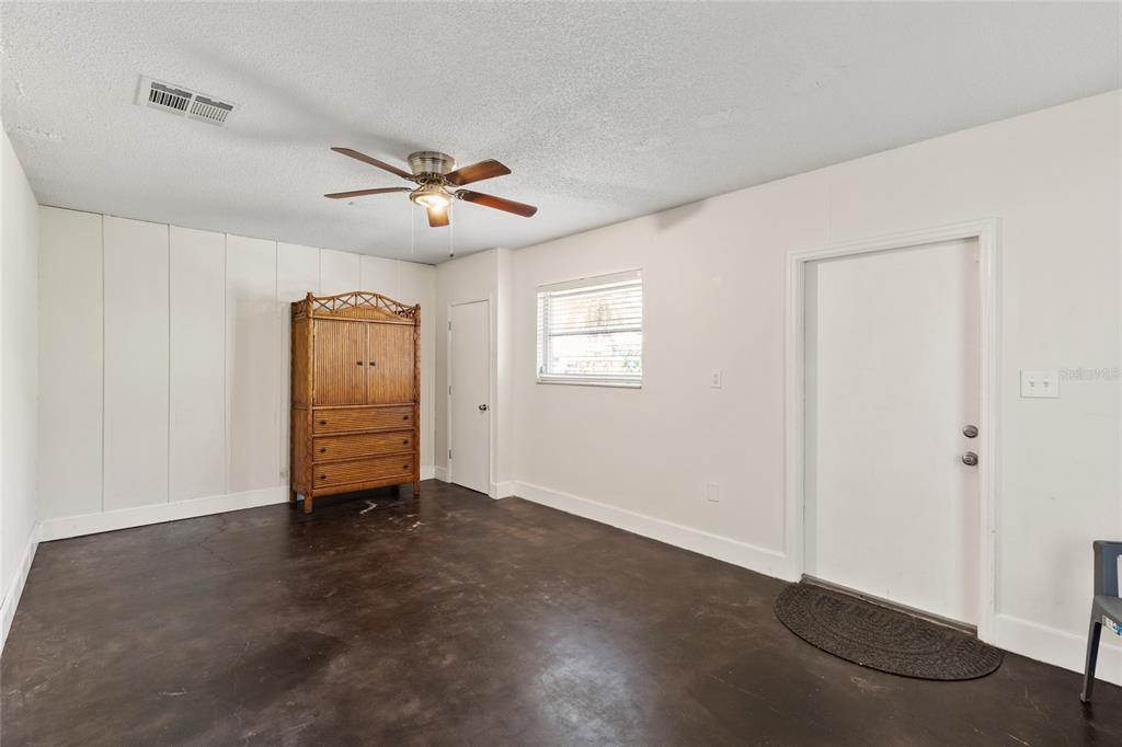 1009 Kings Court Venice, FL 34293 - Photo 18 of 25 wooden floor in an empty room with a window